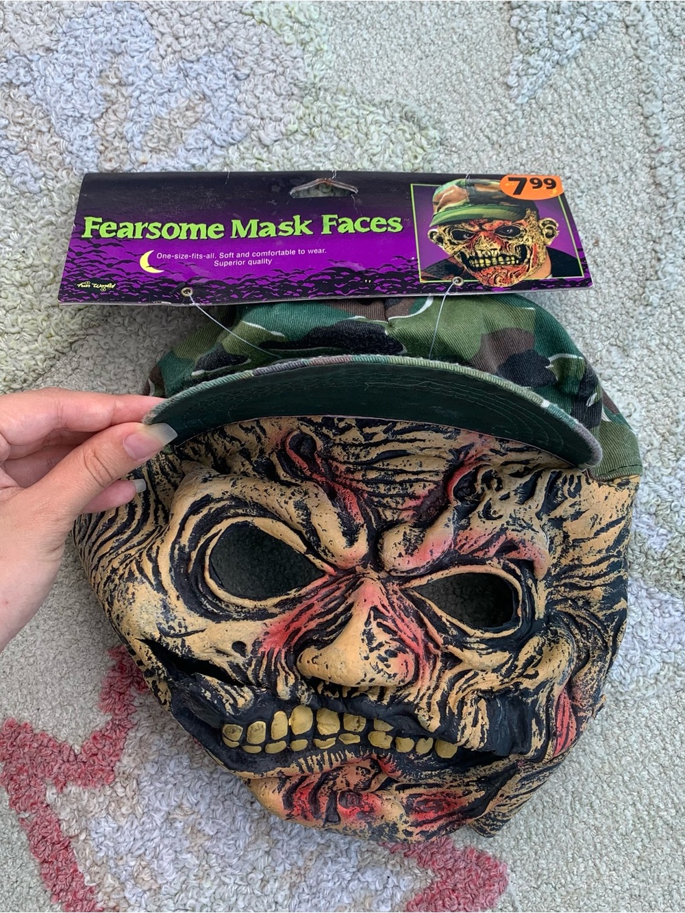 Easter Unlimited Zombie Hunter Monster Mask attached to a green camouflage cap